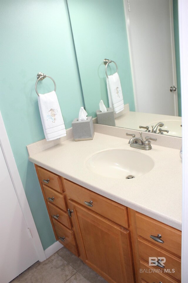 bathroom featuring tile patterned floors and vanity