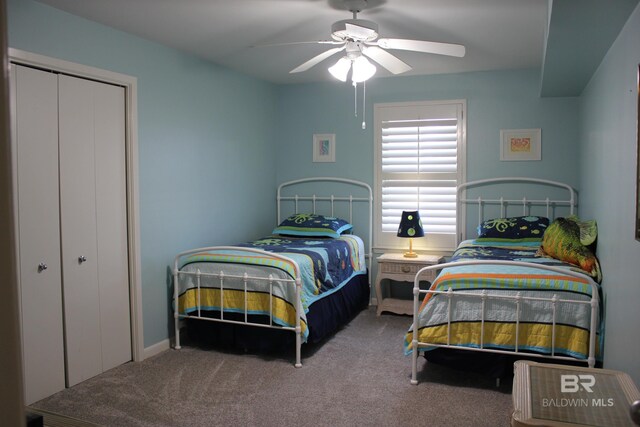 carpeted bedroom with a closet and ceiling fan