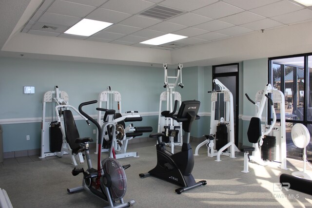 exercise room with a drop ceiling