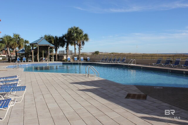 view of swimming pool featuring a patio