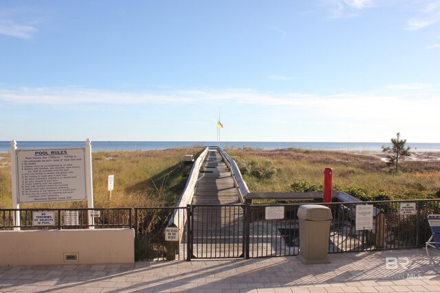 view of gate featuring a water view