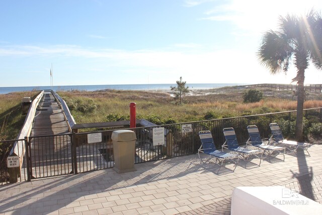 view of patio with a water view