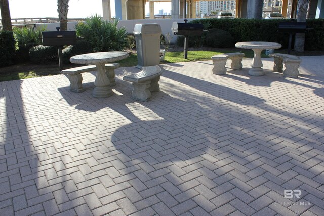 view of patio featuring a grill