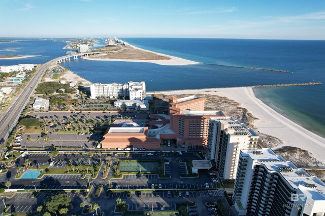 birds eye view of property featuring a view of the beach and a water view