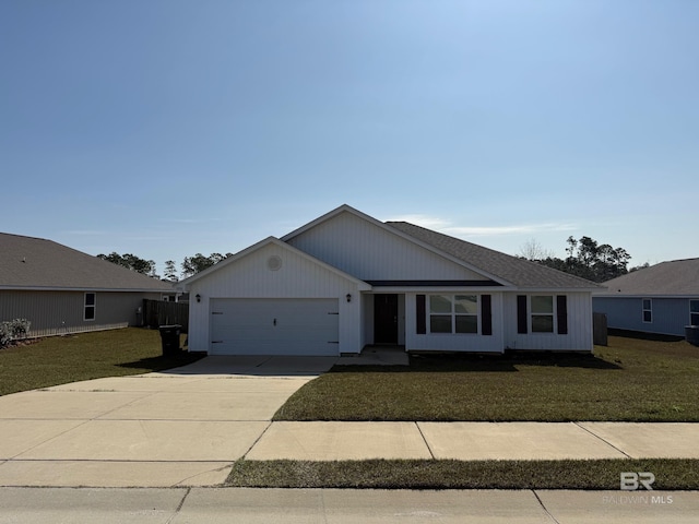 single story home featuring driveway, a front yard, and a garage