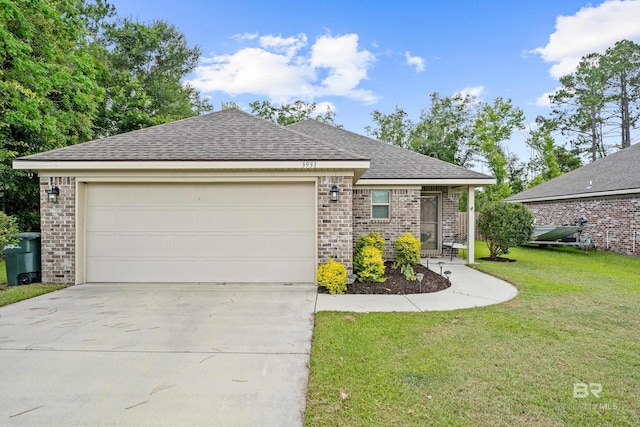 3931 Langley Ave, Foley, AL 36535 - view of front facade featuring brick siding, driveway, a shingled roof, and a front yard