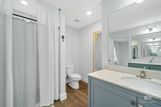 3931 Langley Ave, Foley, AL 36535 - bathroom featuring vanity, wood finished floors, recessed lighting, and a shower with shower curtain