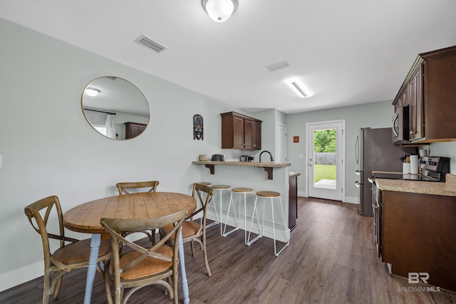 3931 Langley Ave, Foley, AL 36535 - dining space featuring baseboards and dark wood-style flooring