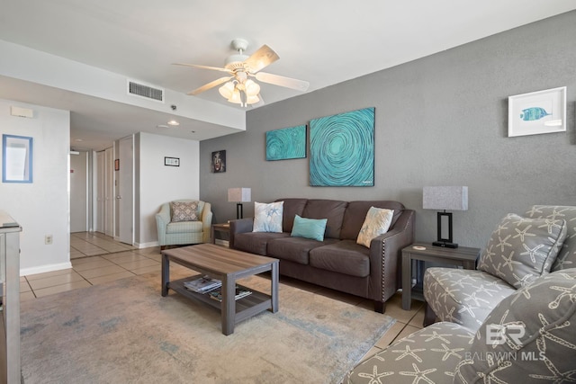 living room with ceiling fan and light tile patterned floors