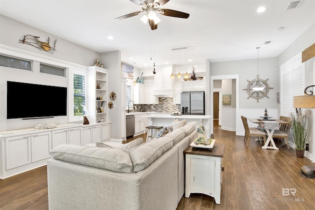 living area featuring dark wood finished floors, recessed lighting, visible vents, and ceiling fan