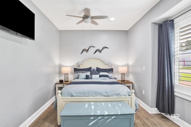 bedroom with a ceiling fan, recessed lighting, wood finished floors, and baseboards