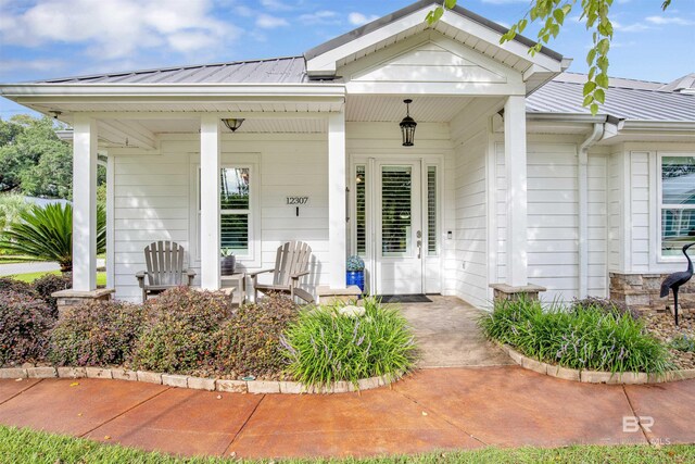 doorway to property featuring a porch