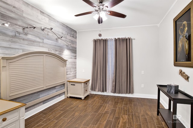 interior space featuring ceiling fan, baseboards, and wood tiled floor