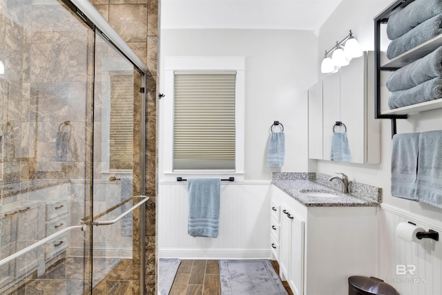 full bath featuring a shower stall and vanity