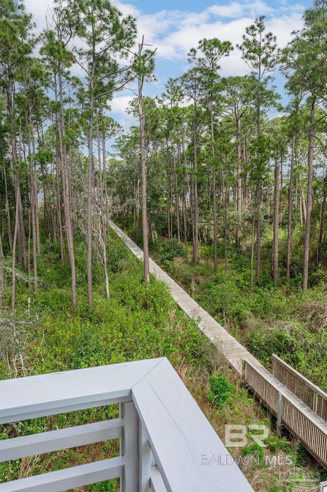 view of yard with a balcony