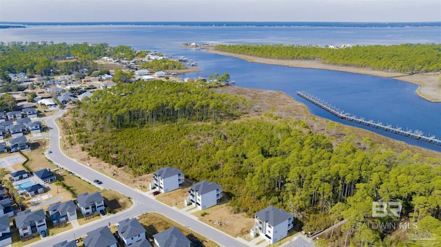 birds eye view of property with a water view and a residential view