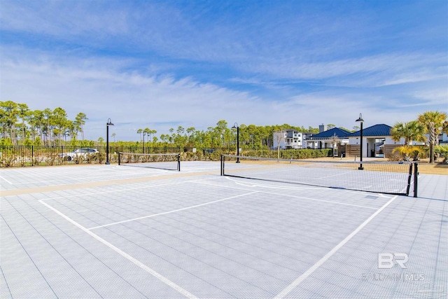 view of sport court with fence