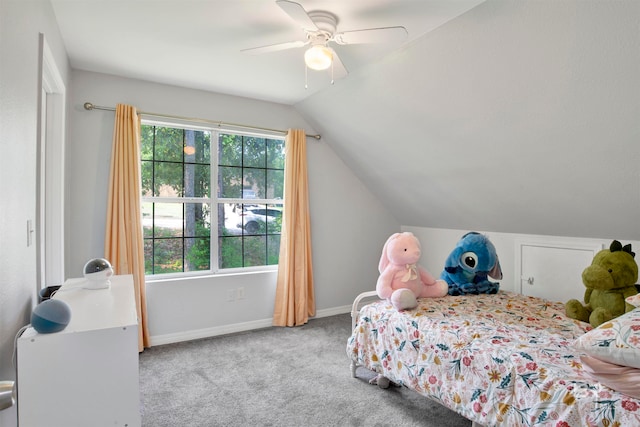 carpeted bedroom with lofted ceiling, ceiling fan, and multiple windows