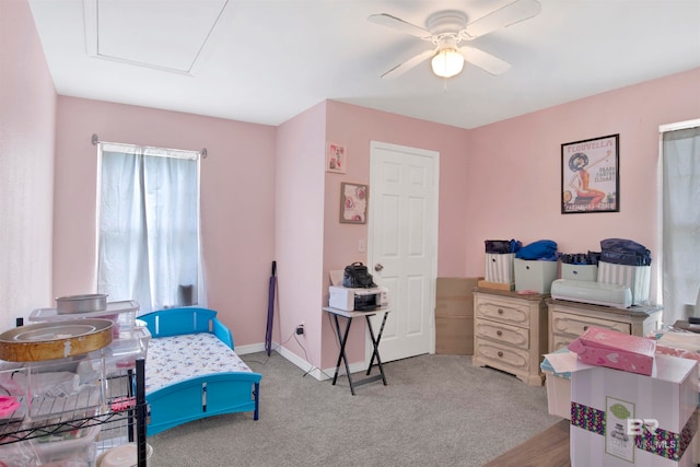 bedroom with ceiling fan and light carpet