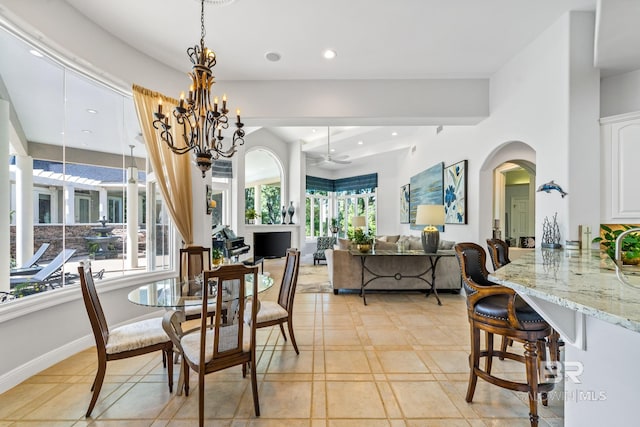 dining area with an inviting chandelier and light tile patterned floors