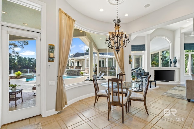 dining room with plenty of natural light, a notable chandelier, and tile patterned floors