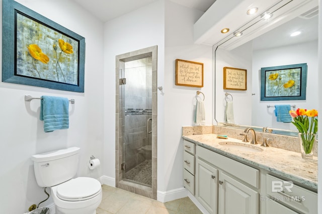 bathroom with vanity, toilet, walk in shower, and tile patterned flooring