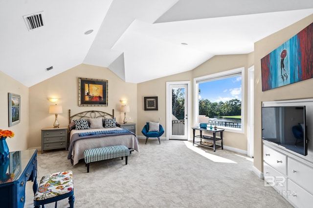 carpeted bedroom with access to exterior and vaulted ceiling