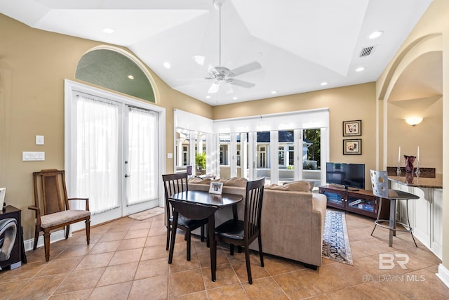 dining space featuring lofted ceiling, ceiling fan, and french doors