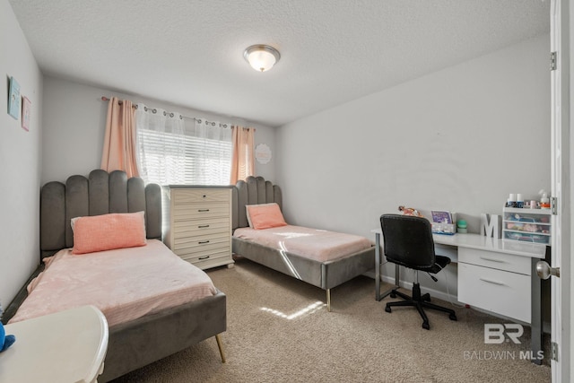 bedroom featuring carpet floors and a textured ceiling