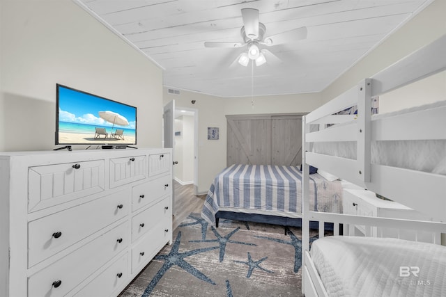 bedroom with hardwood / wood-style floors and ceiling fan