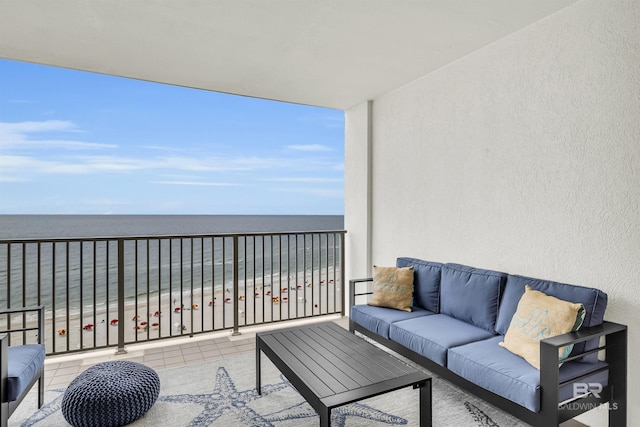 balcony featuring a beach view, an outdoor living space, and a water view