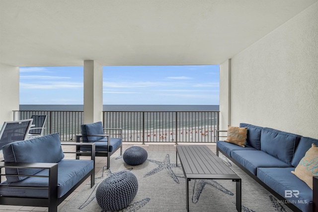 view of patio / terrace with outdoor lounge area and a water view