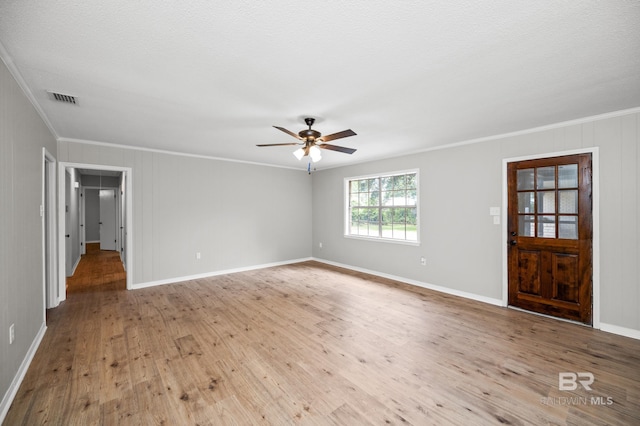 interior space with crown molding, a textured ceiling, ceiling fan, and light hardwood / wood-style floors