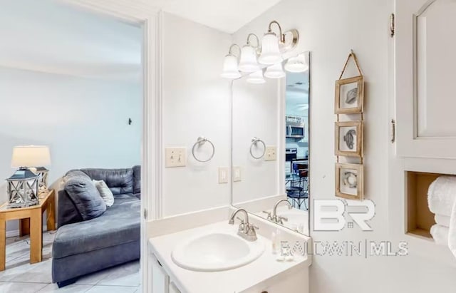 bathroom with vanity and tile flooring