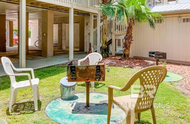 exterior space featuring a patio area and a lawn