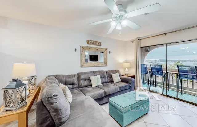 living room featuring ceiling fan and light tile floors