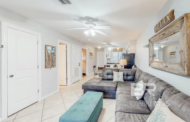 living room with ceiling fan and light tile floors