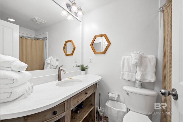 full bathroom with visible vents, toilet, and vanity