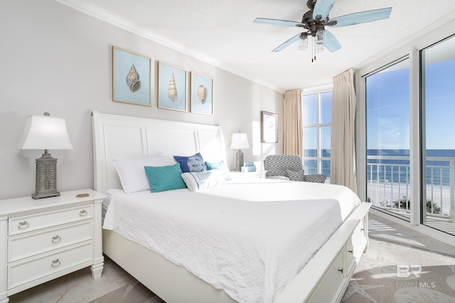 bedroom with access to exterior, ceiling fan, a water view, and ornamental molding