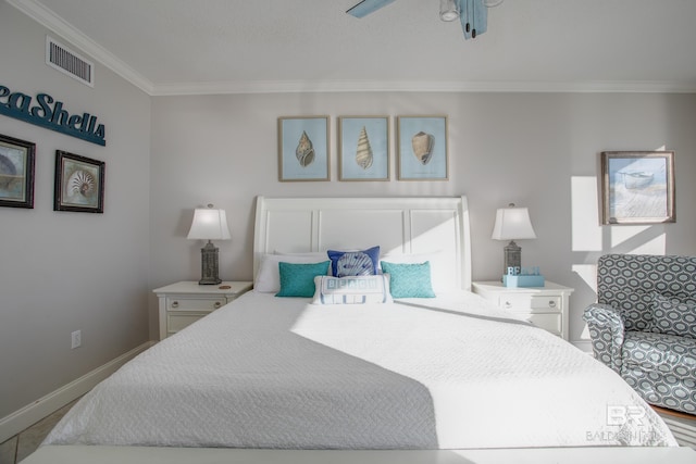 bedroom with ceiling fan and crown molding