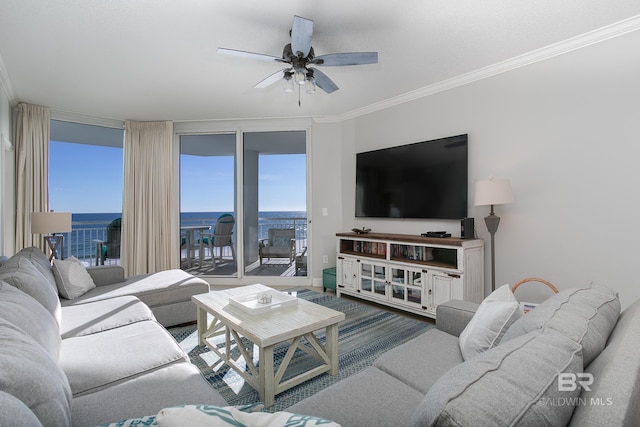 living room featuring ceiling fan, floor to ceiling windows, and ornamental molding