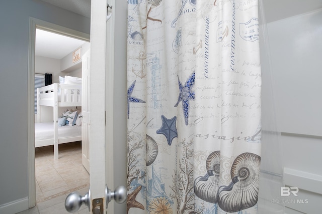 bathroom with tile patterned flooring