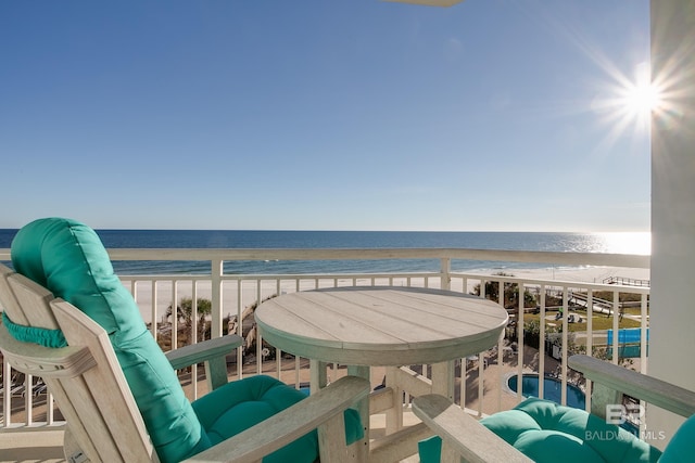 balcony with a view of the beach and a water view