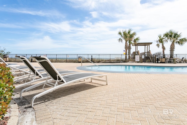 view of swimming pool featuring a patio