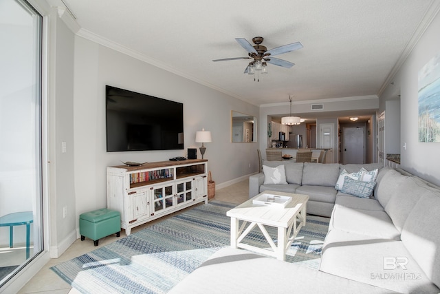 living room with ceiling fan, crown molding, and light tile patterned flooring