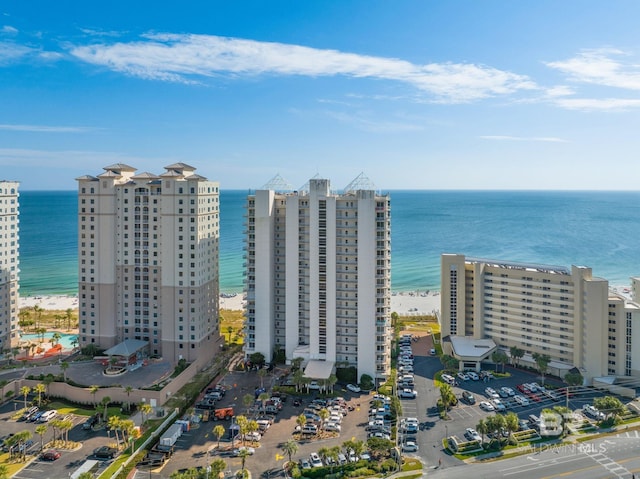 birds eye view of property featuring a view of the beach and a water view