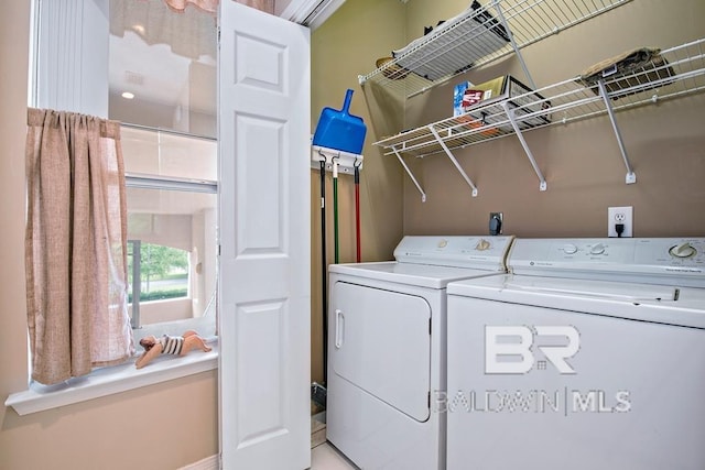 clothes washing area featuring laundry area and independent washer and dryer