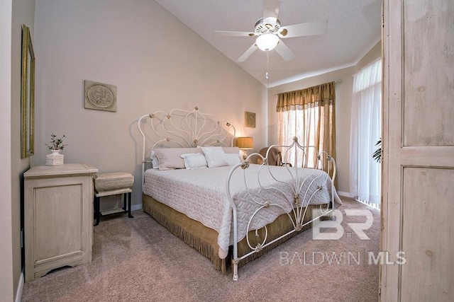 bedroom featuring light carpet, ceiling fan, vaulted ceiling, and baseboards