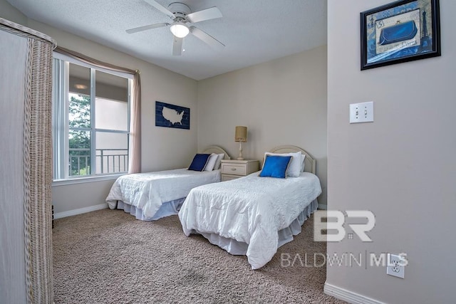 bedroom with a textured ceiling, ceiling fan, carpet flooring, and baseboards