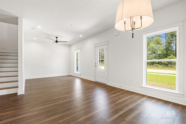 659 Island Way, Gulf Shores, AL 36542 - unfurnished living room with plenty of natural light, stairway, dark wood-type flooring, recessed lighting, and a ceiling fan